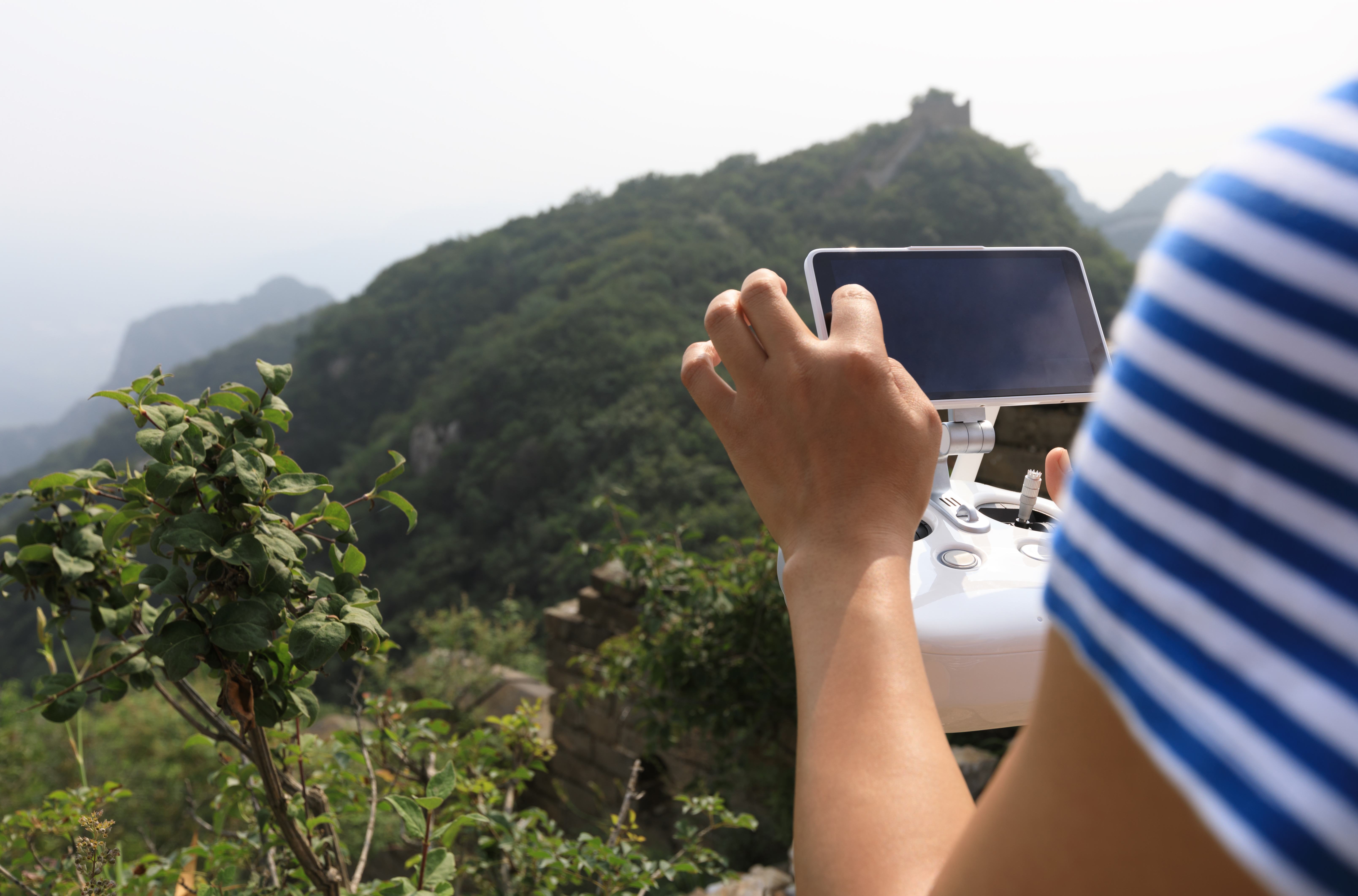907937628 flying drone taking photo of the great wall landscape in China