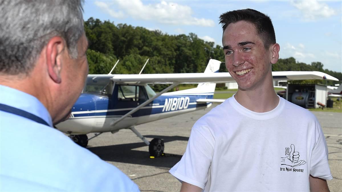 Joel Cihak talks to his father Tony after completing three solo flights during Liberty University's New Horizons Solo Academy. Photos by David Tulis.