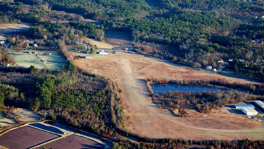 Newly cut trees beyond the end of a gravel runway at the Taunton Municipal - King Field airport in Taunton, Massachusetts. Photo courtesy of Mike Dupont.