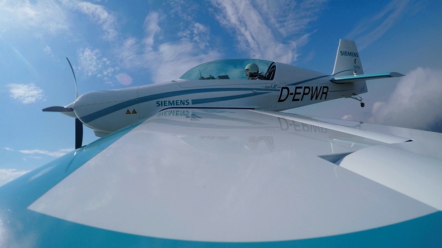 Walter Extra, the famous aerobatic pilot behind the Extra series of aerobatic planes, has set a FAI world record in the new field of electric-powered planes. Photo courtesy of www.siemens.com/press.