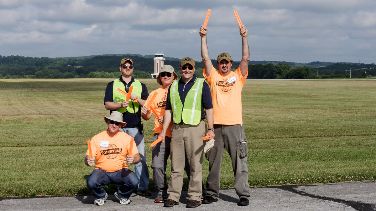 Volunteers made safe, efficient operations possible, and this crew took time out to show some pride during the 2015 AOPA Fly-In at the association's home in Frederick, Maryland.  