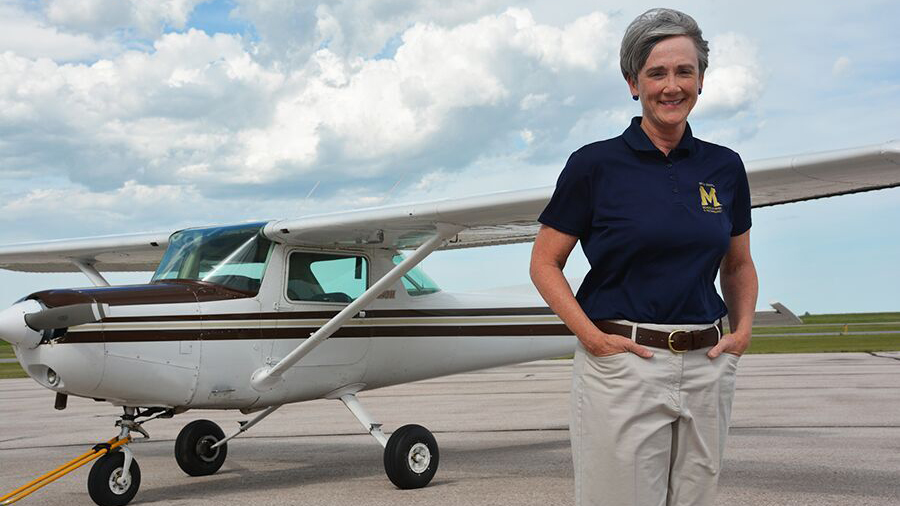 South Dakota Mines President Heather Wilson with her Cessna 152.