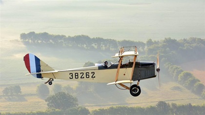 The Friends of Jenny Curtiss JN4 takes a morning flight over the Kentucky countryside. Photo by Mike Collins.