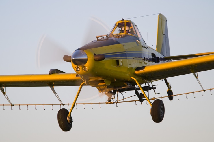 An Air Tractor makes a pass in this AOPA file photo. The company recognizes that technology developed for drones may one day allow the pilot and seat to be removed from aircraft like this. 