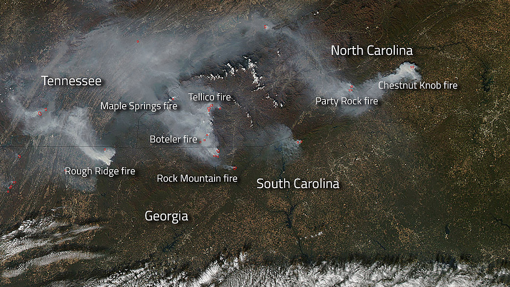 A NASA Aqua satellite image using Moderate Resolution Imaging Spectroradiometer information captures actively burning bands of wildfires (shown in red) and their accompanying smoke spreading across parts of Georgia, North Carolina, South Carolina, and Tennessee on Nov. 12. Photo courtesy of NASA/Goddard, Lynn Jenner.