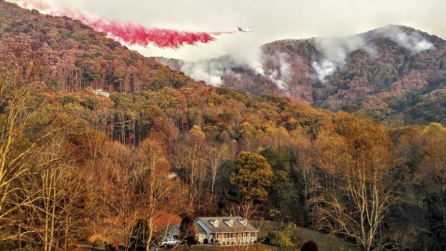 A heavy air tanker drops fire retardant over the Boteler wildfire near Hayesville, North Carolina, Nov. 10. Reuters photo courtesy of Michael David Chiodini.