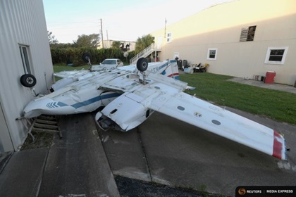 An airplane lies upside down at the Ormond Beach Municipal Airport in the aftermath of Hurricane Matthew in Ormond Beach, Florida, U.S. October 9, 2016. REUTERS/Phelan Ebenhack