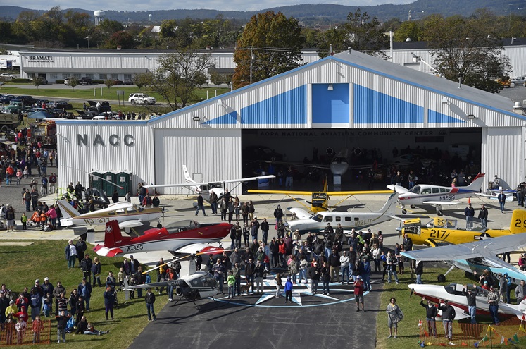 The inaugural Wings 'n Wheels aircraft, automobile, and motorcycle event that began as a gathering between friends drew almost 2,500 to AOPA's National Aviation Community Center at the Frederick Municipal Airport in Frederick, Maryland, Oct. 22. Photo by David Tulis.