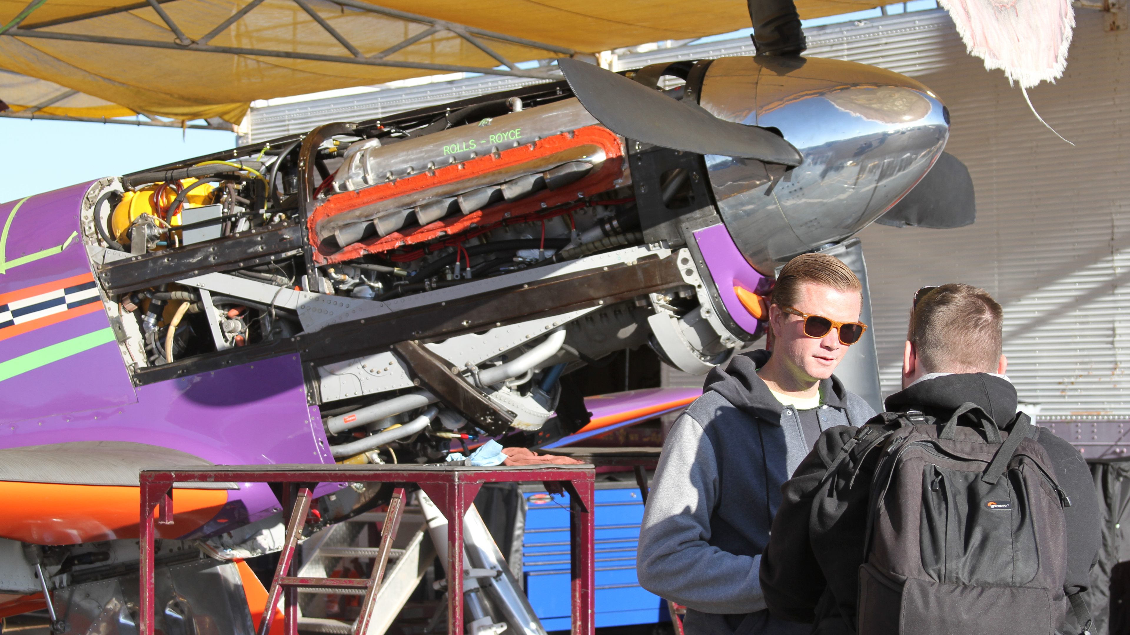 Voodoo, Bob Button's highly modified P-51D, is uncowled in the Reno pits before racing begins. Pilot Steve Hinton won the 2013 and 2014 Unlimited Gold in this airplane. Photo by Robert Fisher.