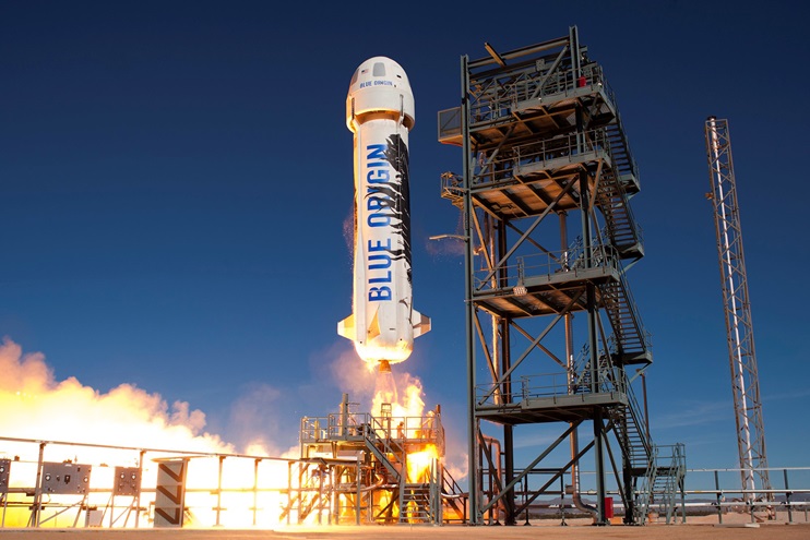 The New Shepard rocket lifts off during a test flight. Photo courtesy of Blue Origin.