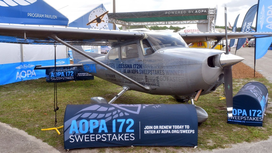 The AOPA 172 Sweepstakes grand prize is beside the AOPA tent at Sun 'n Fun, and invites comparisons to the partially refurbished Skyhawk displayed last year.