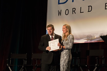 Justin Adams accepts the Drones for Good Innovator of the Year award from the Commercial Drone Alliance at Drone World Expo in San Jose, California, Oct. 4. He headed straight to Puerto Rico after the conference to fly damage surveys following Hurricane Maria. Jim Moore photo.