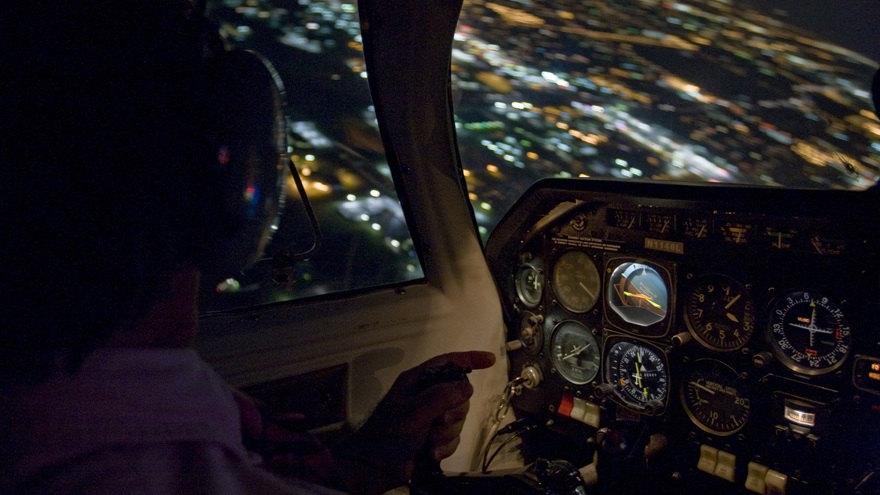 In flight night cockpit photography of a pilot turning over Jabara Airport on the east side of Wichita, KS.