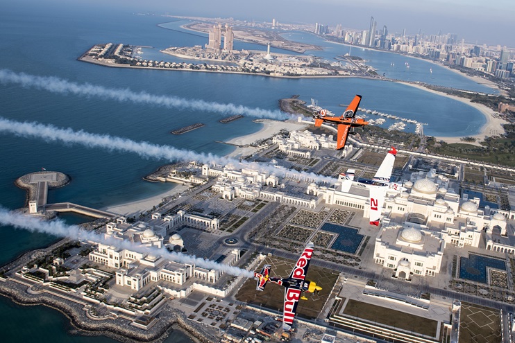 Defending Red Bull Air Race World Champion Matthias Dolderer of Germany leads fellow pilots Nicolas Ivanoff of France and Martin Sonka of the Czech Republic on a pre-race flight over the new 160,000-square-meter Presidential Palace in Abu Dhabi, United Arab Emirates, Feb. 6. Photo by Predrag Vuckovic/Red Bull Content Pool.