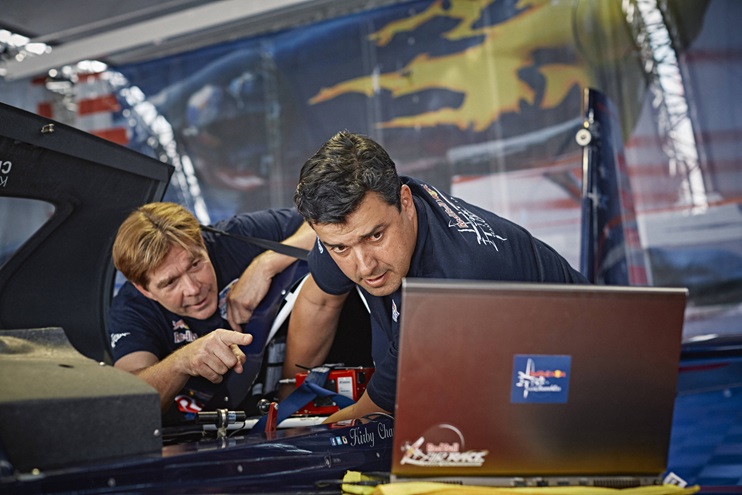 Kirby Chambliss talks with his team tactician Paulo Iscold during a practice session at Las Vegas Motor Speedway in October 2016. Photo by Balazs Gardi/Red Bull Content Pool.