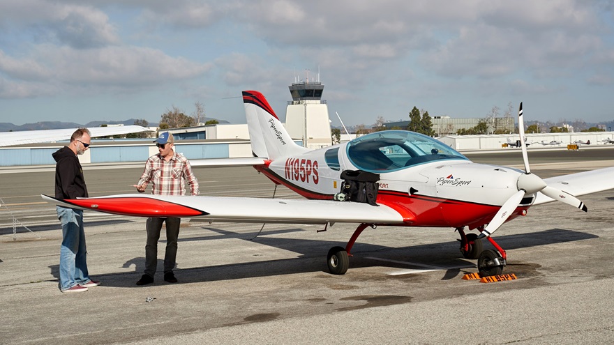 An instructor and student prepare for a flight lesson. Photo by Mike Fizer.