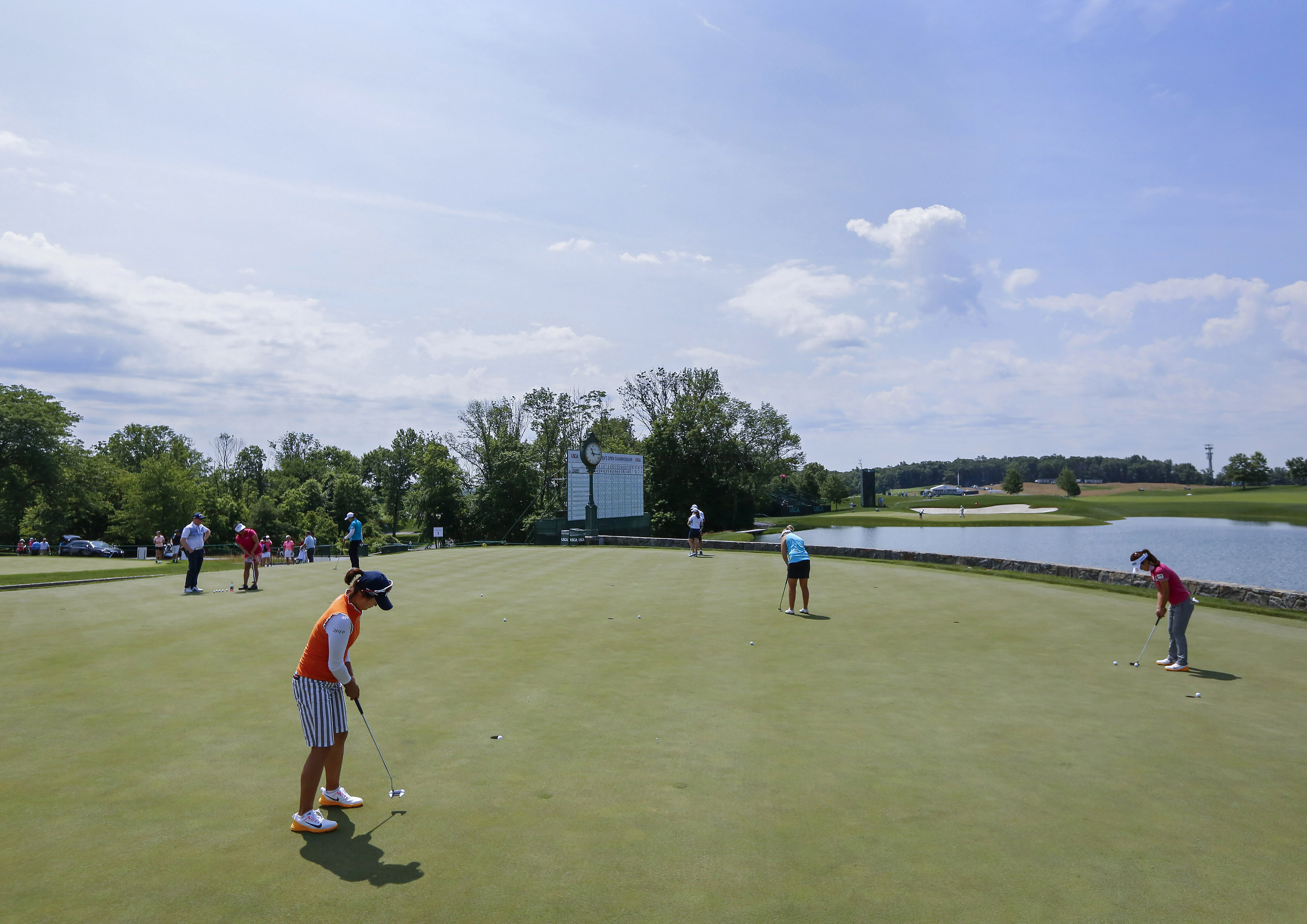 Golfers putt during a practice round at Trump National Golf Club in Bedminster, New Jersey, as it prepares to host the 2017 Women's U.S. Open. Photo courtesy of Andrew Mills, NJ Advance Media.