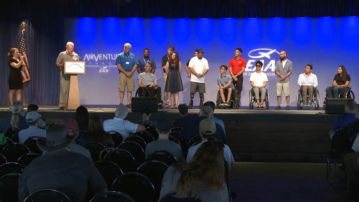 Eight recent Able Flight scholarship winners earn their wings during a ceremony at EAA AirVenture in Oshkosh, Wisconsin. Image by Paul Harrop.