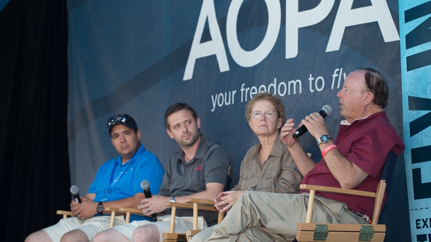 King Schools co-founder John King, right, speaks during the AOPA Drone Social at EAA AirVenture July 27. Fellow panelists include his wife and King Schools co-founder Martha King, Ryan Braun of uAvionix (center), and Colin Romberger of DARTdrones (left). Jim Moore photo.