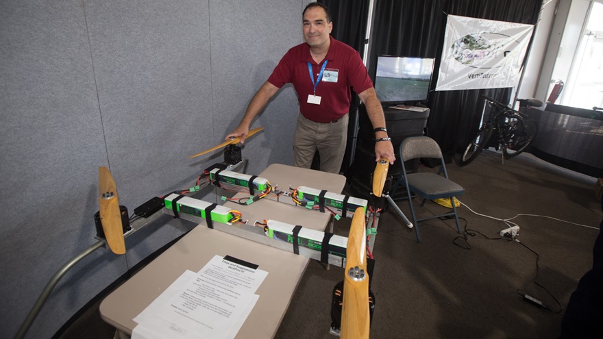 Pete Bitar, founder of the Indiana company AirBuoyant and inventor of the VertiPod quadcopter made for heavy lifting, said he scarcely got a chance to sit during the week of EAA AirVenture, with so many visitors to the company display. Jim Moore photo.