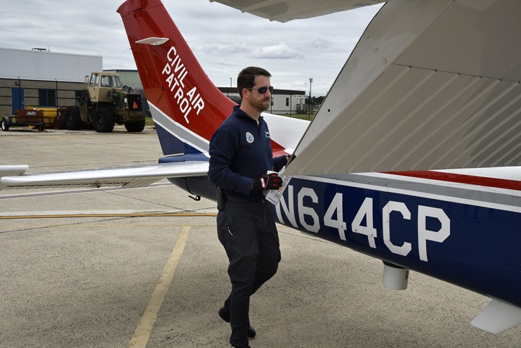 Civil Air Patrol volunteer pilot Scott Faulkner preflights a Cessna 182 before a joint mission by NORAD, the Civil Air Patrol, and the Coast Guard from the 177th Fighter Wing in Egg Harbor Township, New Jersey. Photo by David Tulis.