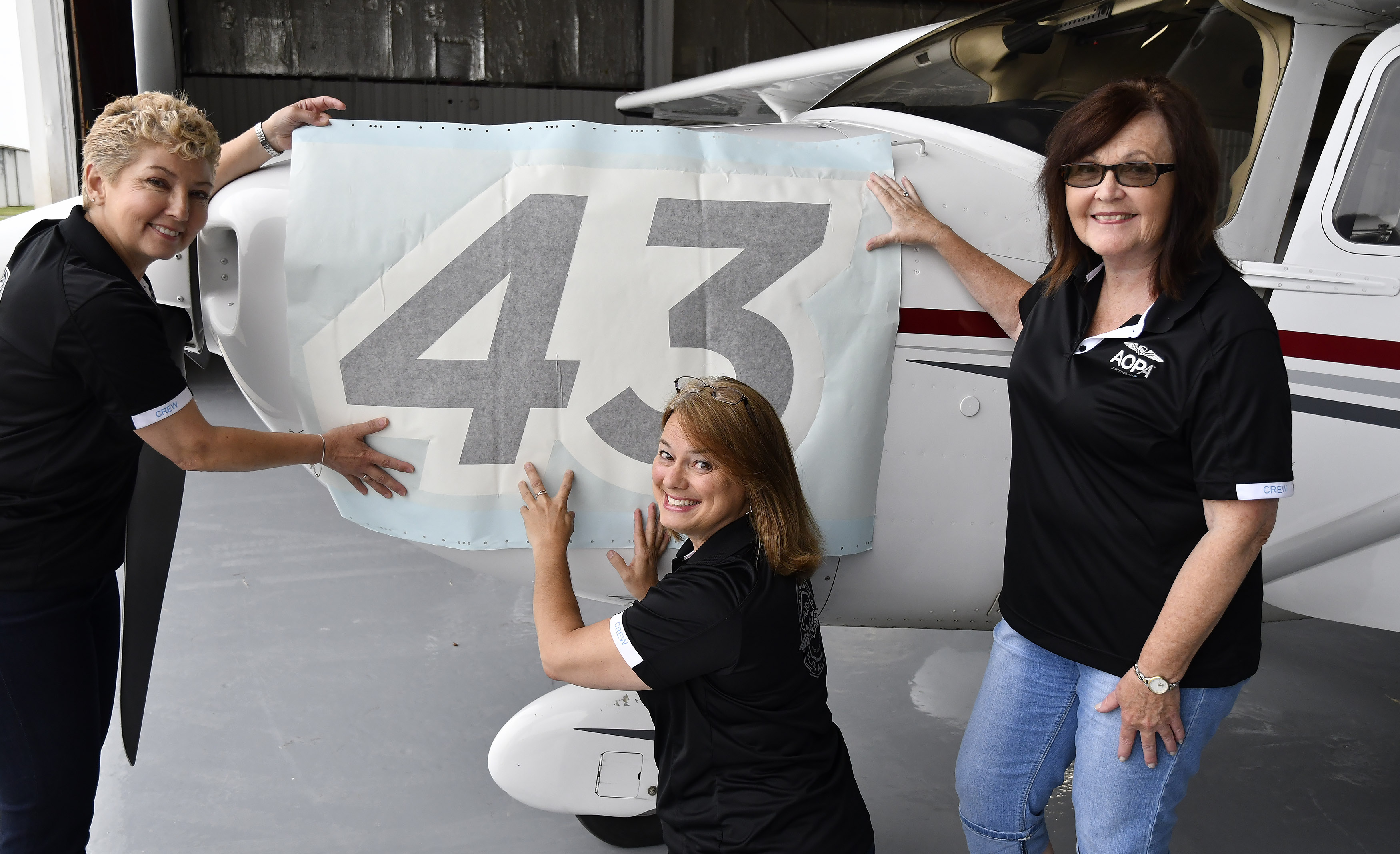 Air Race Classic pilots Luz Beattie, Paula Wivell, and Kathy Dondzila are known as the AOPAngels. Photo by David Tulis.