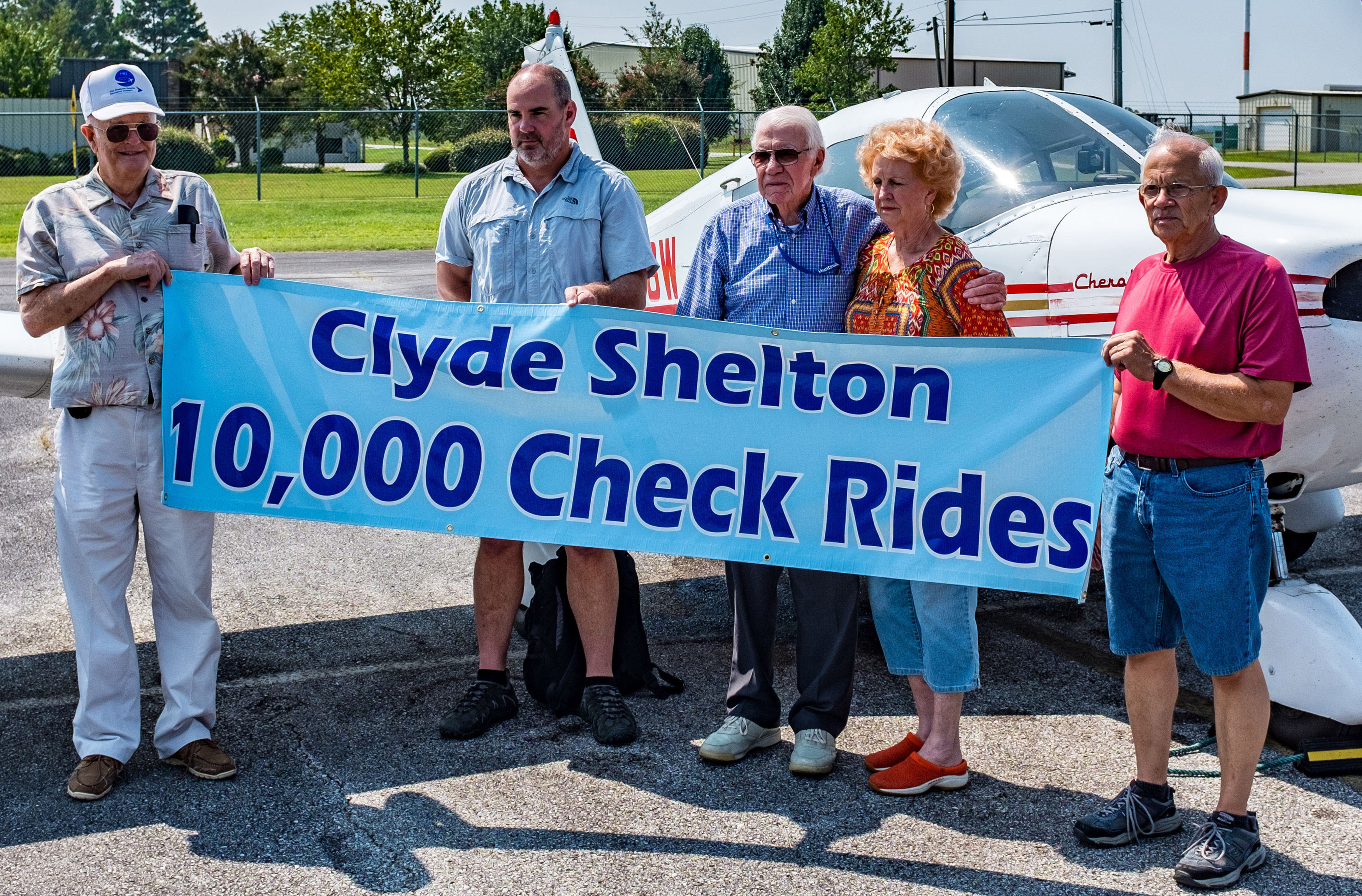 Clyde Shelton celebrates administering his 10,000th flight exam. Photo courtesy of Marty Sellers/sellersphoto.com.