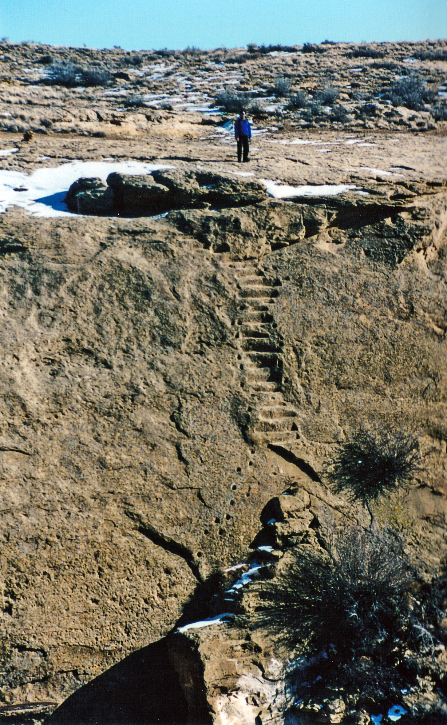 The prehistoric stairway and handholds were carved into this cliff by the Chacoan people who made this area the center of a vast trading zone radiating hundreds of miles in all directions from what is now Chaco Culture National Historical Park. Photo by Crista Worthy.