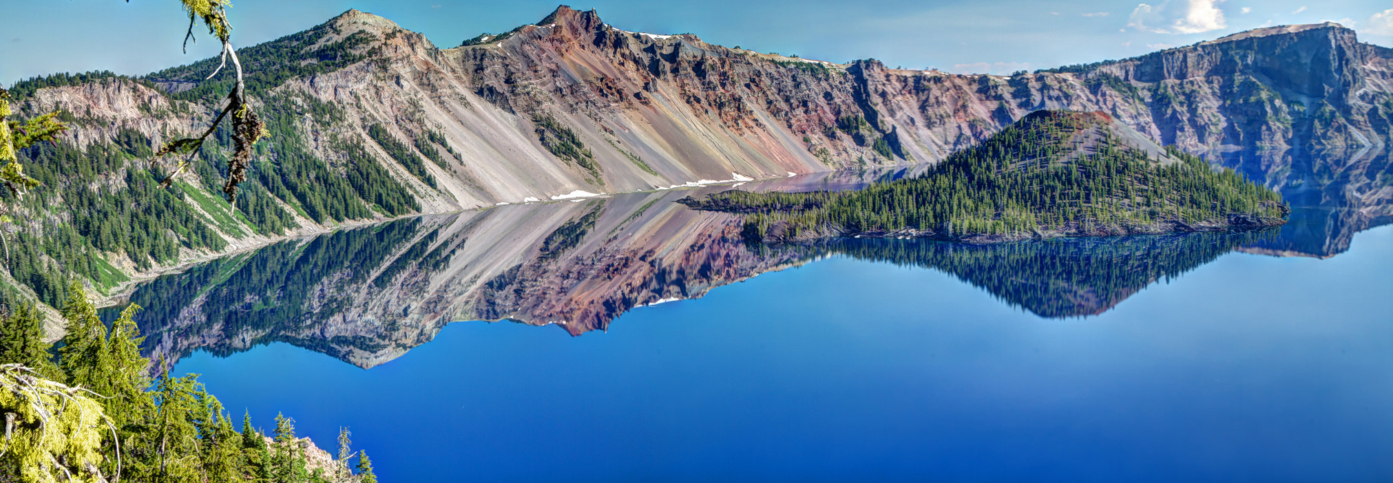 On a clear, still day Crater Lake’s deep blue reflective water is mesmerizing. Photo by Scott Smithson via Flickr.