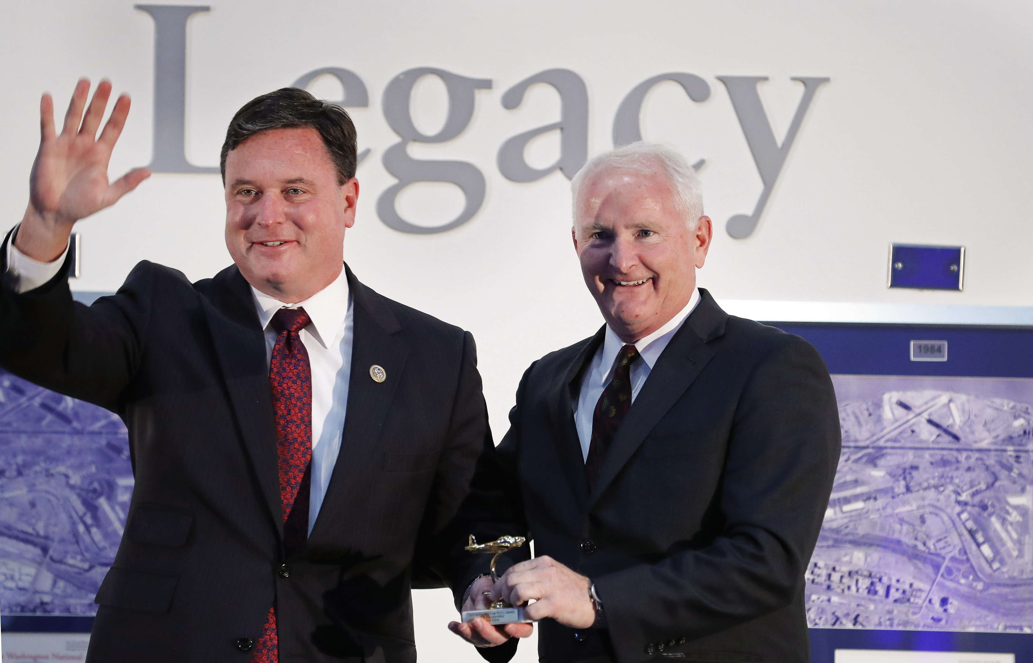 Rep. Todd Rokita (R-Ind.), is presented an award by AOPA President Mark Baker during the second annual Bob Hoover Trophy Reception. Rokita was also honored with the Joseph B. 'Doc' Hartranft Jr. Award. Photo by Chris Rose.