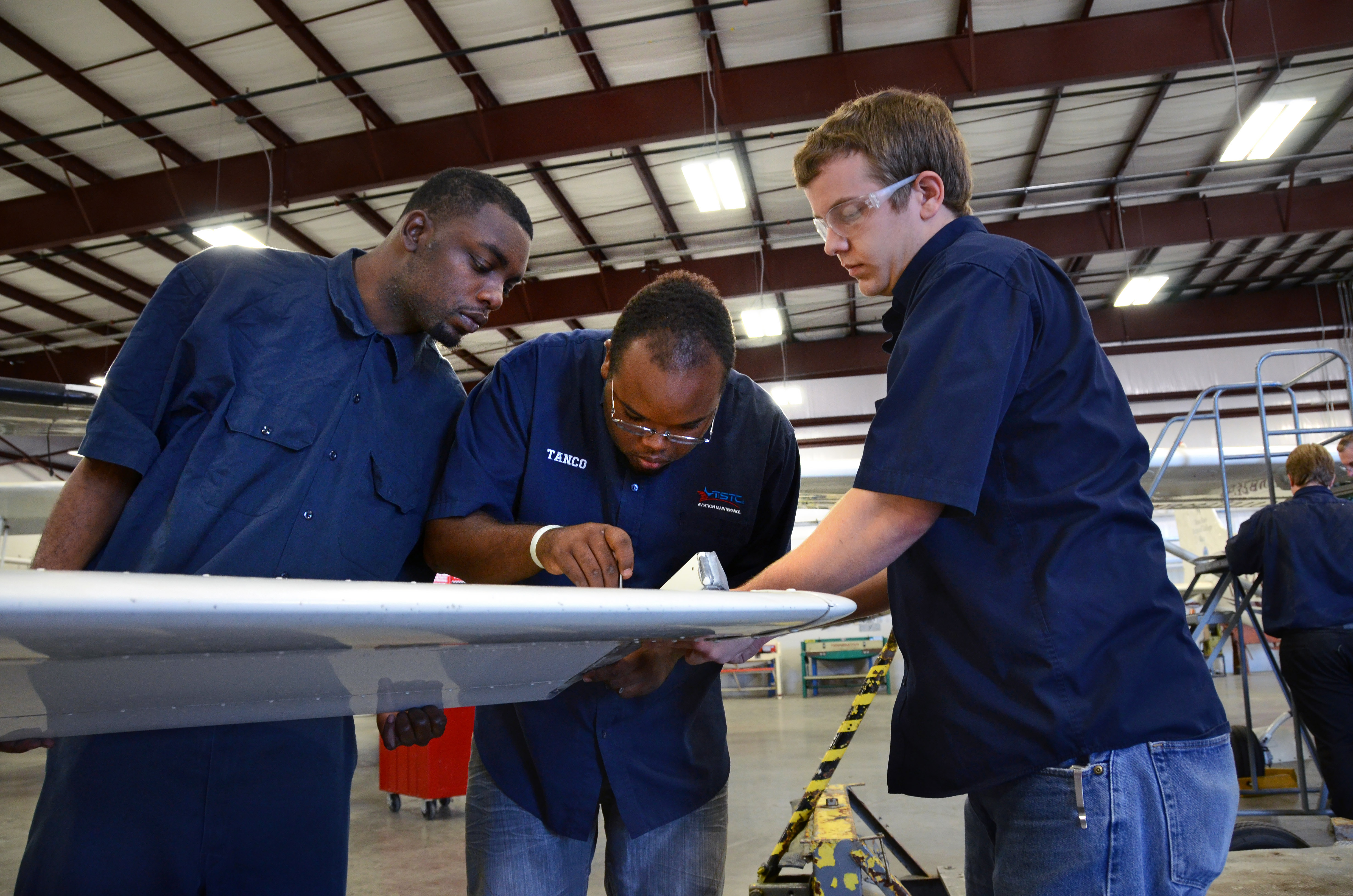 Texas State Technical College A&P mechanics work on an aircraft's tail section. Photo courtesy of Texas State Technical College.