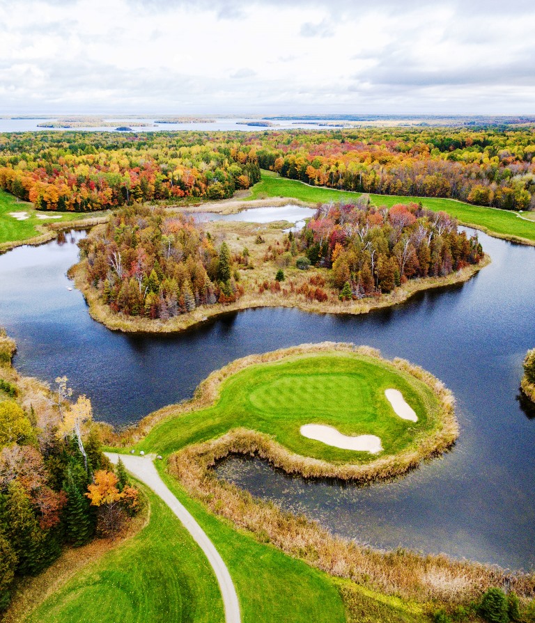 The Drummond Island Resort’s championship golf course, “The Rock,” offers unique greens surrounded by water. Photo courtesy Drummond Island Resort. 