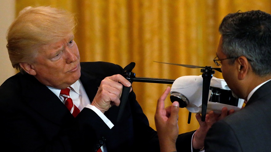 President Donald Trump looks at a drone with Kespry CEO George Mathew (R) during an event highlighting emerging technologies, in the East Room at the White House. The federal government has now launched a program, at the president's direction, seeking to accelerate safe integration of unmanned aircraft. Photo by Jonathan Ernst, Reuters.