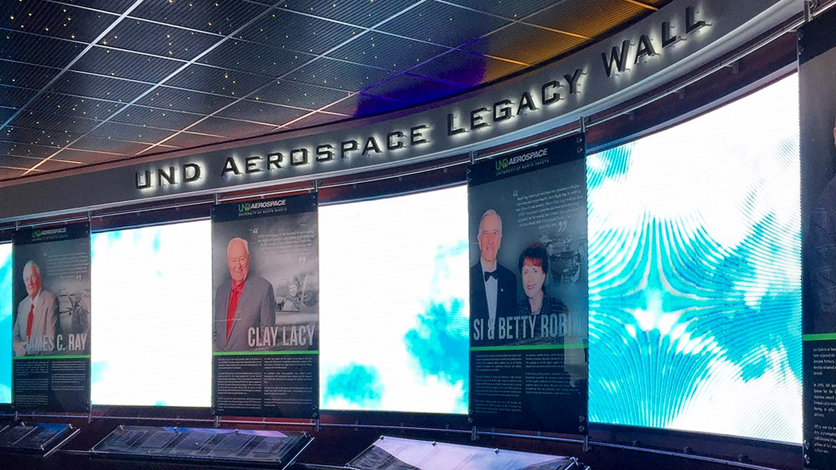 James C. Ray (left) is included in the UND AeroSpace Legacy Wall. Photo by Thomas B. Haines.