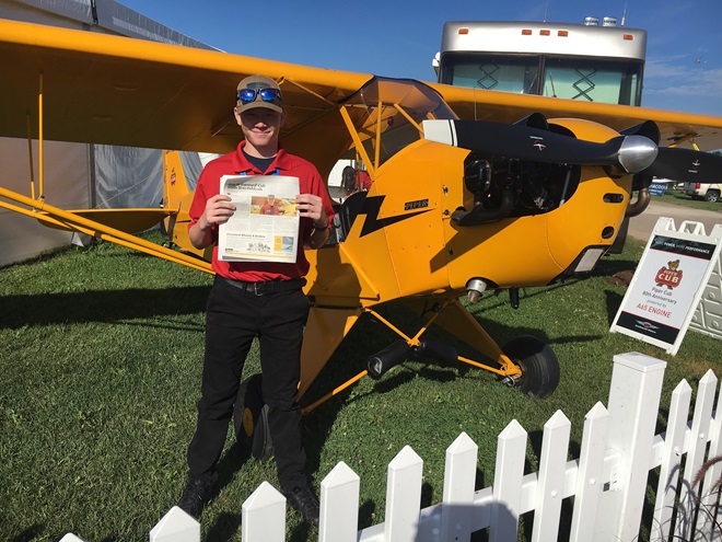 Kyle Carden near a Piper Cub donated to his family by Cub owner Paul Wenz. Photo courtesy of Continental Motors.