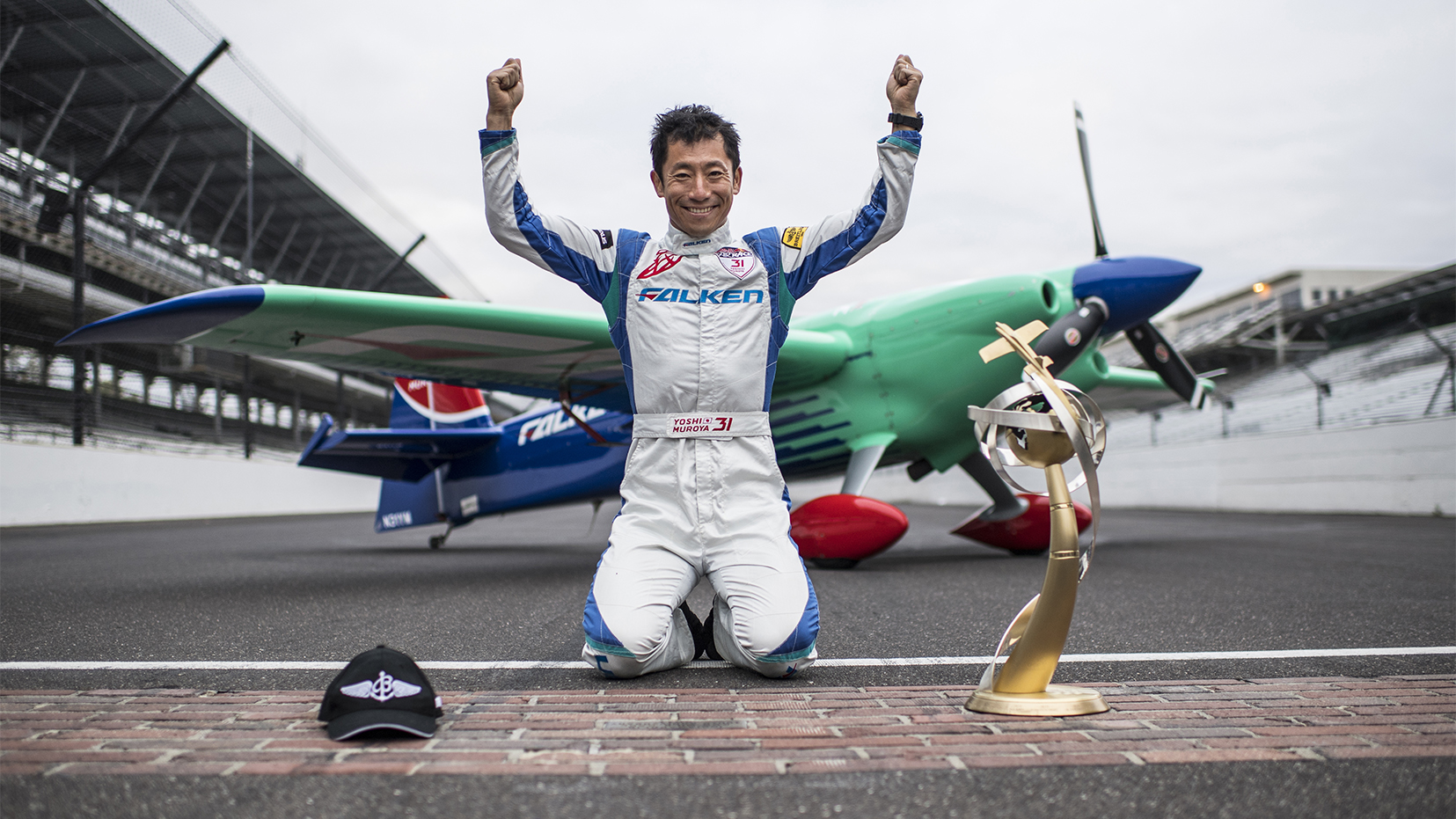 Yoshihide Muroya of Japan poses for a photograph after he won at the eighth round of the Red Bull Air Race World Championship at Indianapolis Motor Speedway. Photo by Joerg Mitter / Red Bull Content Pool.