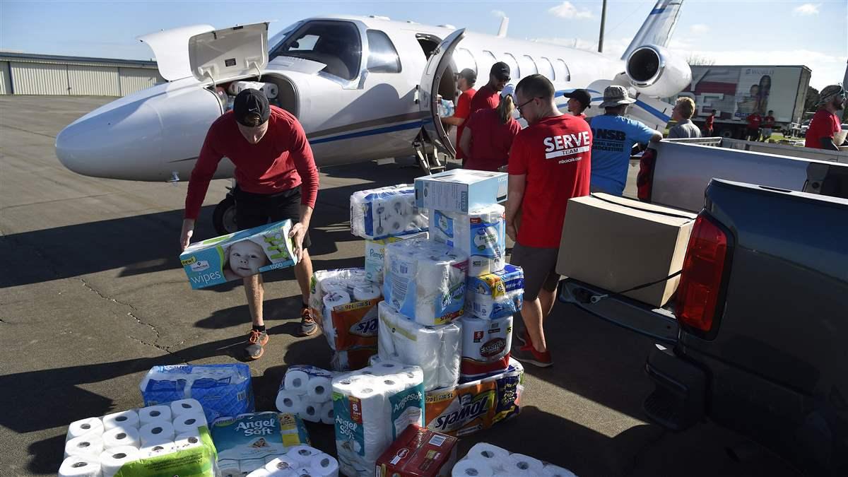 Meadowbrook Church volunteers at Ocala International-Jim Taylor Field Airport load supplies into a Cessna Citation jet bound for St. Croix, U.S. Virgin Islands, Sept. 14. Photo by David Tulis.