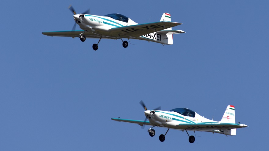 Two Magnus eFusion aircraft, each powered by a Siemens electric motor, make a flyby at AERO Friedrichshafen in Germany in April. Photo courtesy of AERO Friedrichshafen.