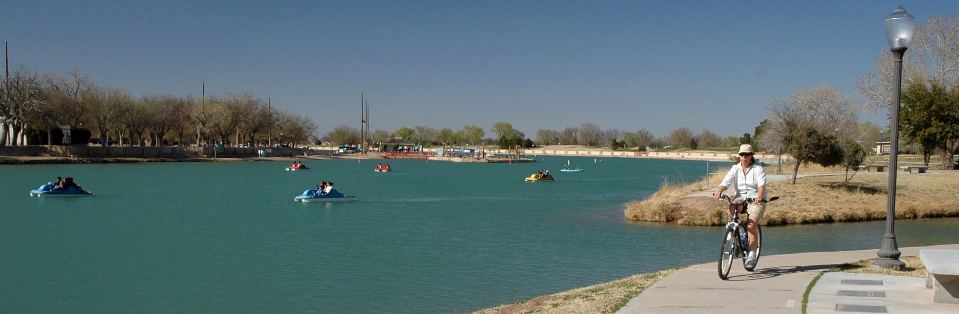 The Pecos River winds slowly through Carlsbad. There are beaches, bike paths, a swimming area, and plenty of room for pedal boats, paddle boards, and kayaks. Photo by Russell Smiths.