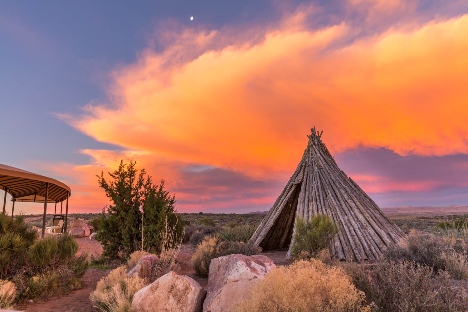At the Native American Village at Eagle Point, you can walk down a path and see authentic dwellings made by Navajo, Hopi, Plains, Havasupai, and Hualapai Tribal members—you’re welcome to go inside. Several wooden poles have been carved with the likenesses of Hualapai members. Photo courtesy Grand Canyon Resort Corporation.