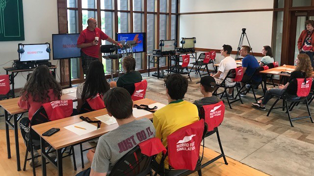 The GAMA 2018 Aviation Design Challenge second-place team from St. Croix Lutheran Academy participates in the Redbird Flight Simulations Science, Technology, Engineering, and Mathematics (STEM) Lab Camp. Photo courtesy of GAMA.
