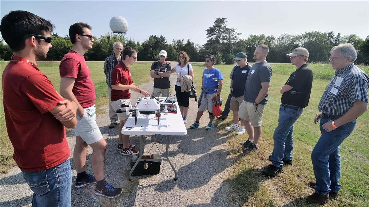 Participants in Friday's all-day weather workshop during AOPA's 2017 Norman Fly-In watch a demonstration of a drone operated by the University of Oklahoma's Advanced Radar Research Center. The workshop was held at the National Weather Center. Photo by Mike Collins.