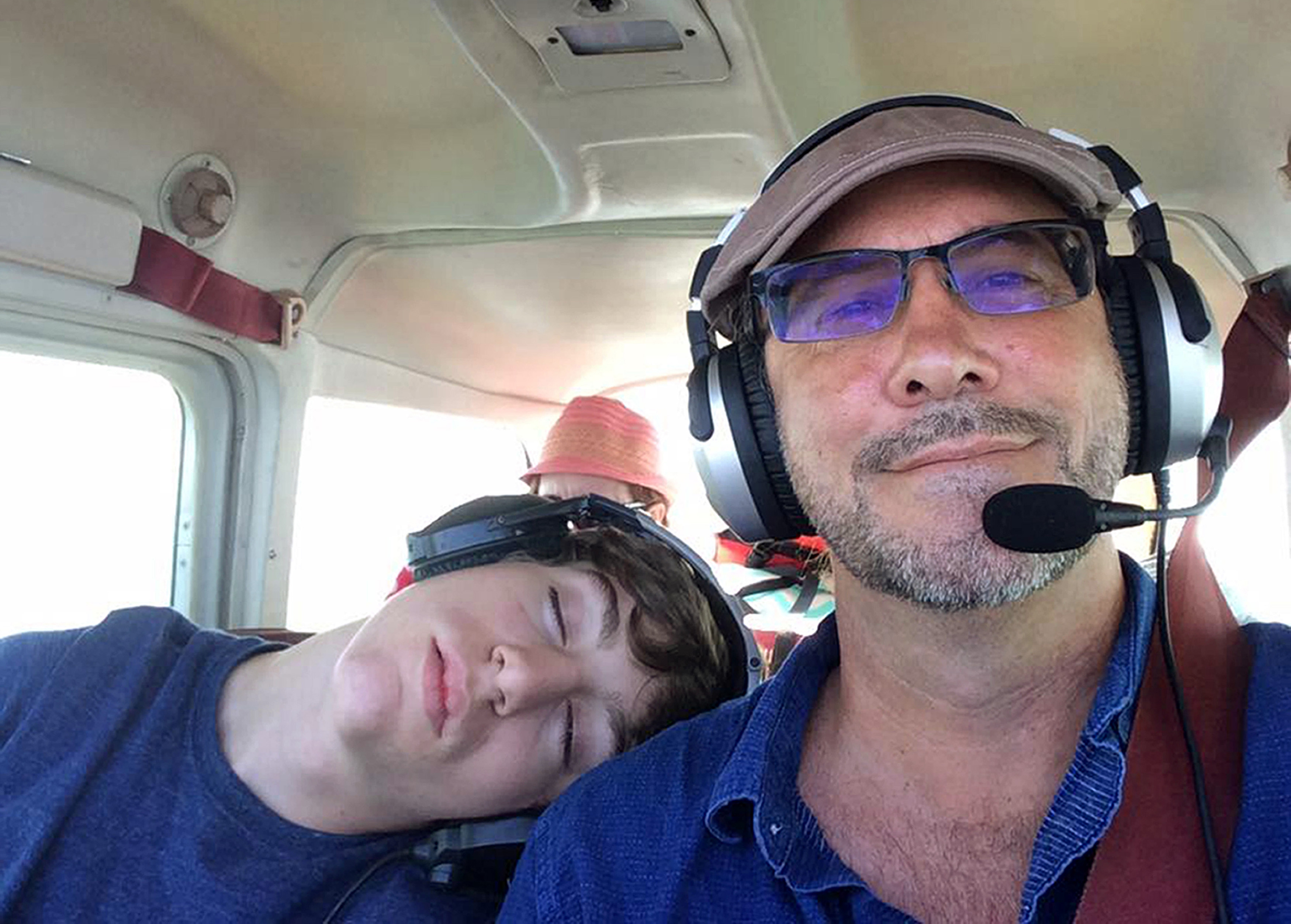 Ardis Sikes, now 17, sleeps on pilot Gerald Herbert's shoulder during a family trip in a Cessna 172. Photo courtesy of Gerald Herbert. 
