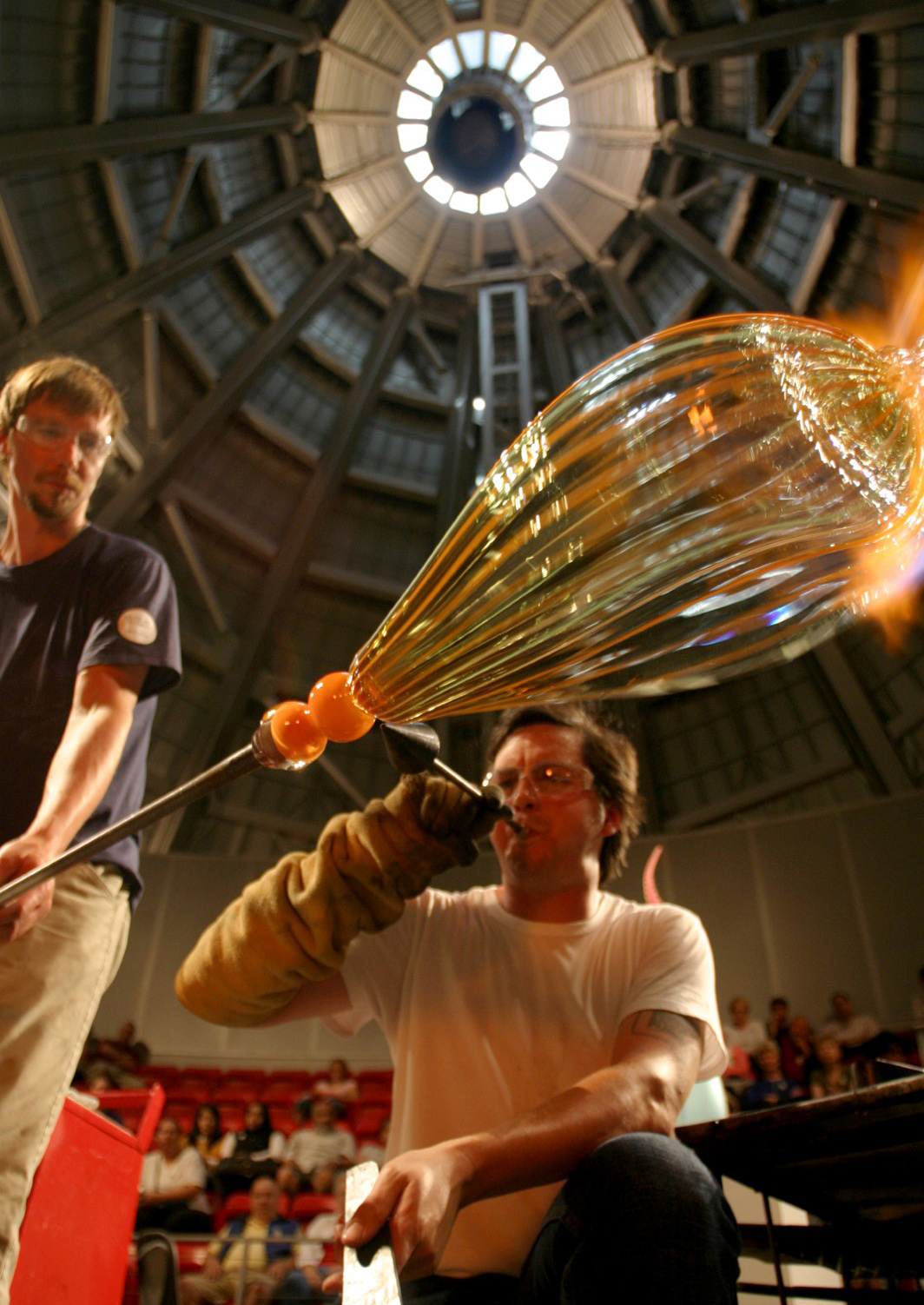 Feel the heat as you watch a team of artists create masterpieces from molten glass in the West Coast's largest Hot Shop—housed inside the iconic 90-foot stainless steel cone at the Museum of Glass. Photo by Mac Donnell.