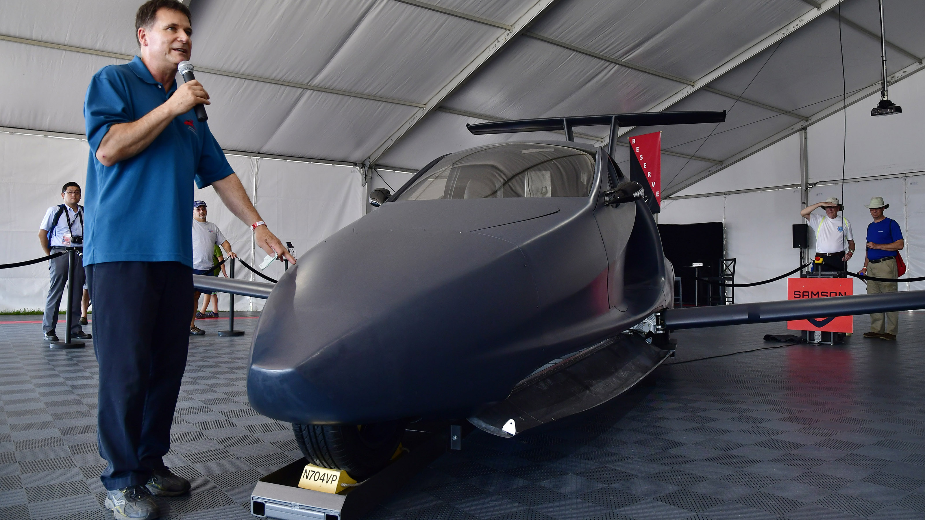 Samson Switchblade's Sam Bousfield describes the flying sports car during EAA AirVenture in Oshkosh, Wisconsin, July 24, 2018. Photo by David Tulis.