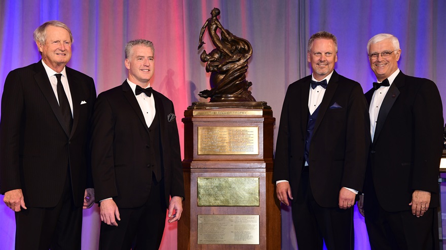 Cirrus Aircraft's Dale Klapmeier, second right, accepted the Collier Trophy for the Cirrus Vision Jet on June 14. Participating in the presentation were National Aeronautic Association Chairman Jim Albaugh, left, Cirrus Aircraft President of Innovation and Operations Patrick Waddick, and NAA President Greg Principato, far right. Photo by David Tulis.