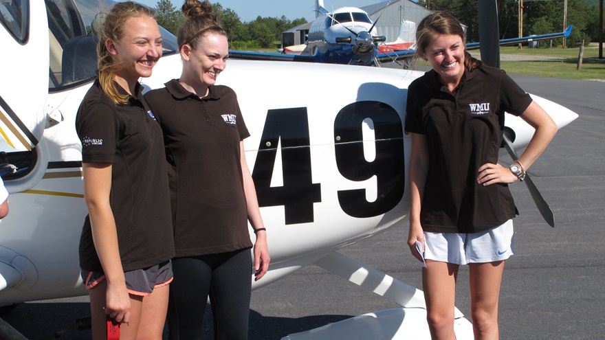 The three members of a flight team from Western Michigan University received a warm welcome in Fryeburg, Maine, after completing the 2018 Air Race Classic on June 21. Lauren Quandt (left), Kelly Erdman (center), and  Shelby Satkowiak flew a Cirrus SR20. Photo by Dan Namowitz.