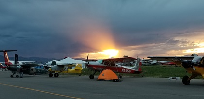 A setting sun illuminates aircraft campers during the AOPA Fly-In at Missoula International Airport, in Missoula, Montana, June 15, 2018. Photo by Carol Dodds.