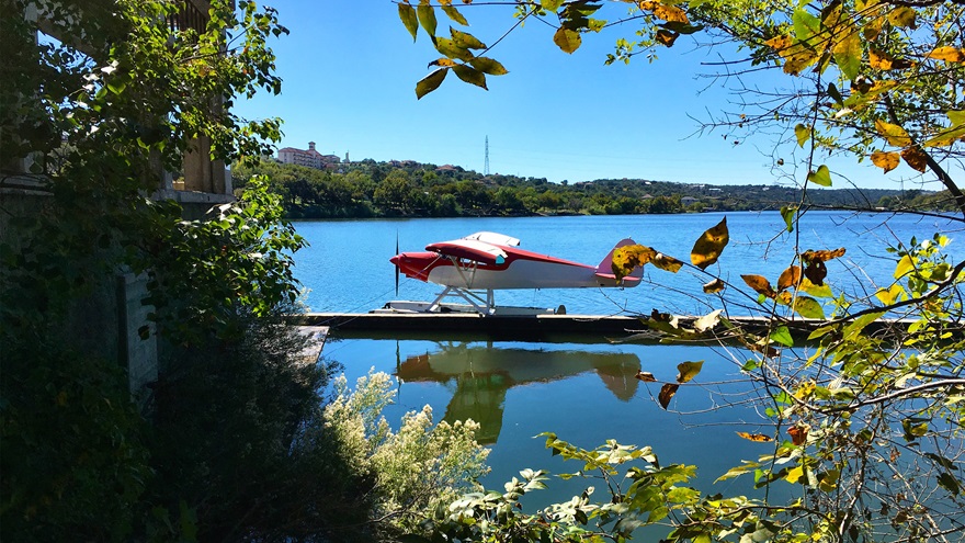 ProMark Aviation Services in Burnet, Texas, works fun into their seaplane training, such as landing on the Colorado River, taxiing under a bridge, and docking to go eat lunch at the River City Grille overlooking the water. Photo by Tres Clinton.