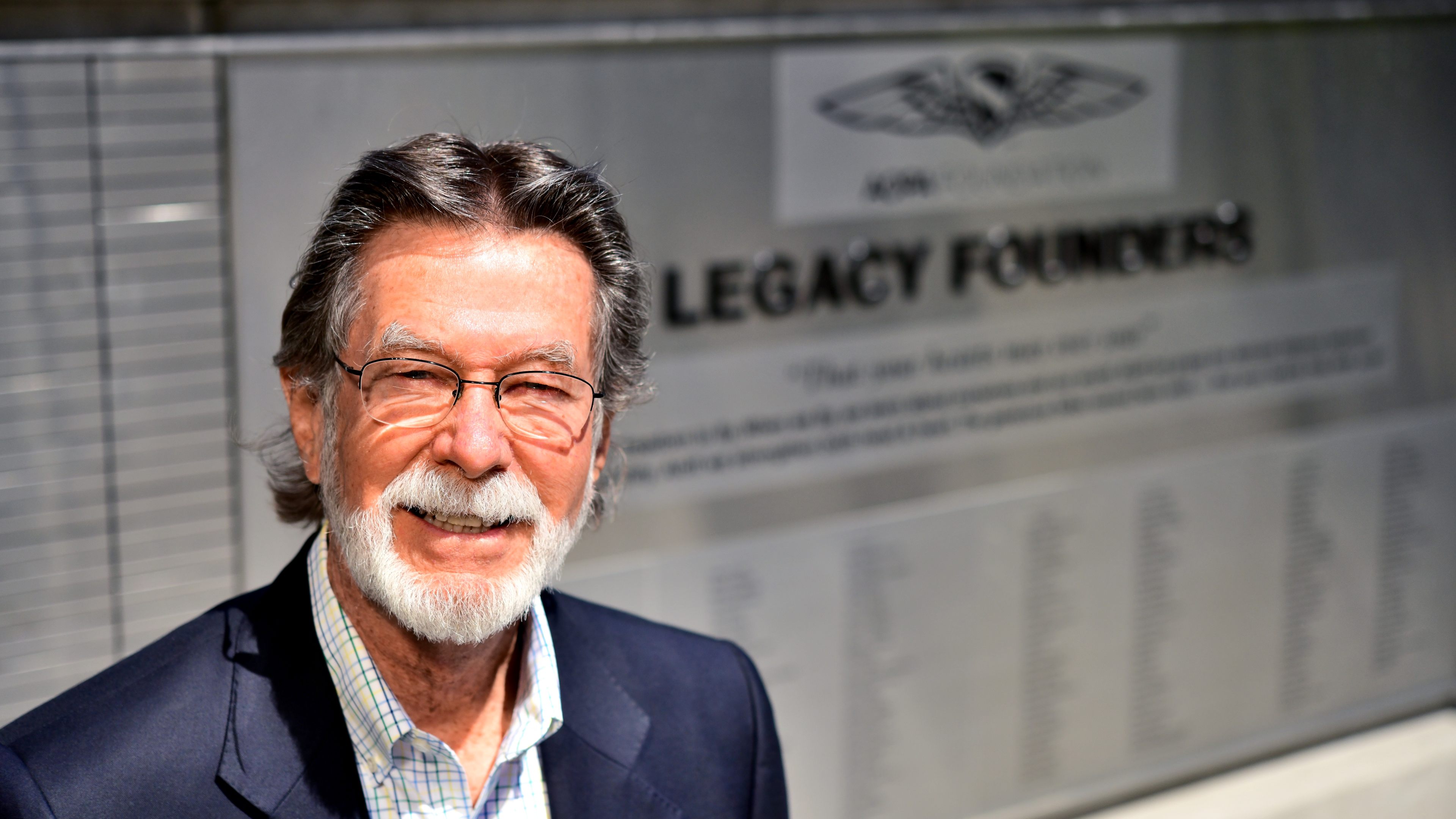 AOPA member Ed McNeil, a supporter of the AOPA Legacy Society, stands in the new Legacy Plaza at AOPA headquarters in Frederick, Maryland. Photo by Mike Collins.